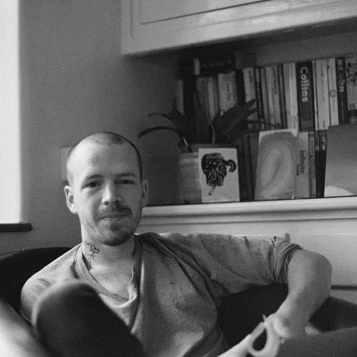 A person sitting on a couch

Description automatically generated with medium confidence